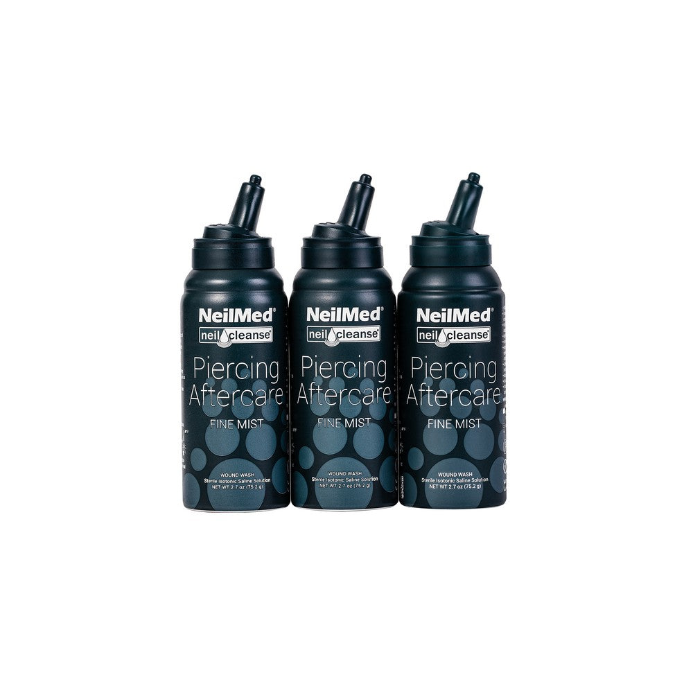 Three bottles of NeilMed Piercing Aftercare on a white background