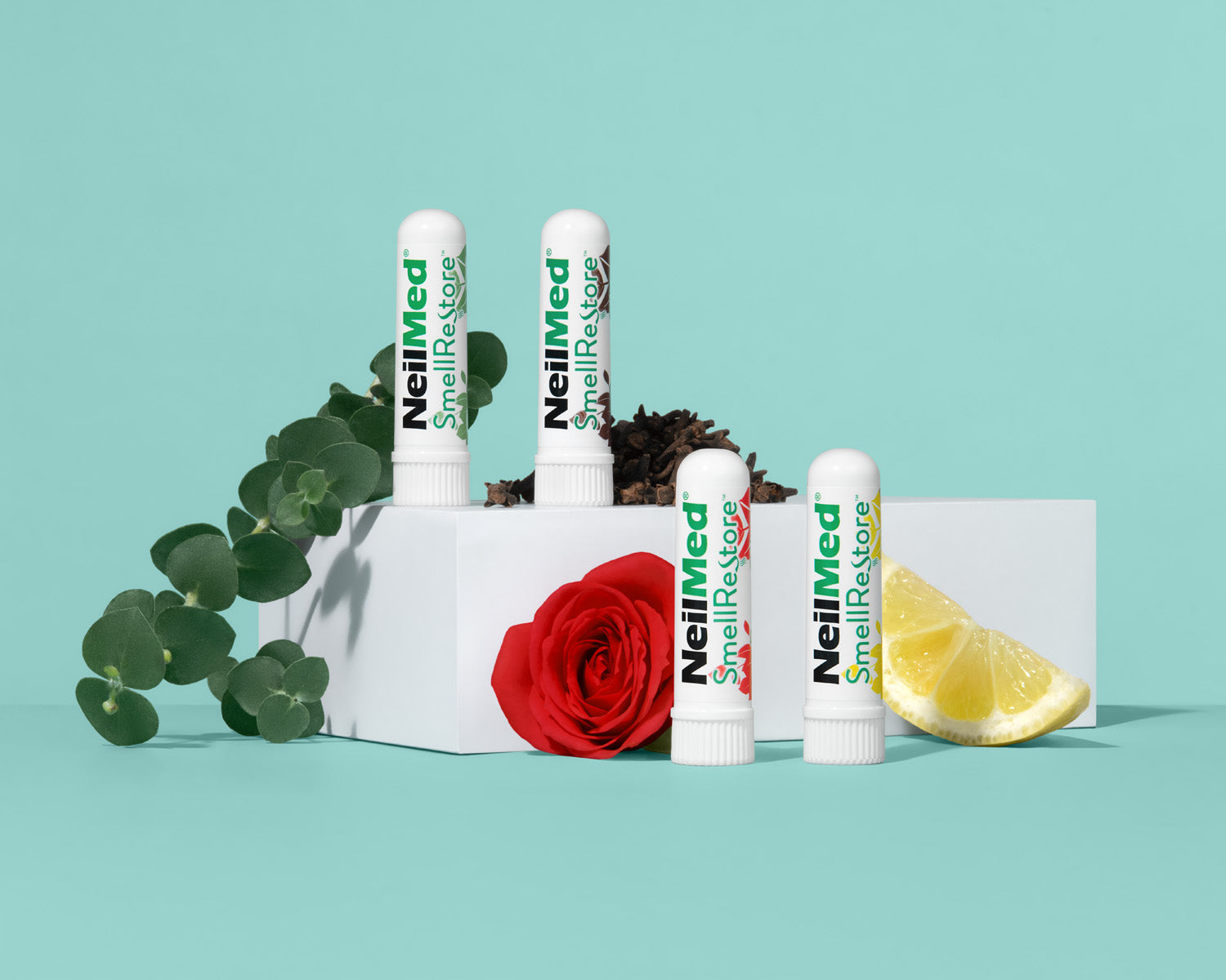 NeiMed SniflereXplosive products with a rose and lemon on a light blue background