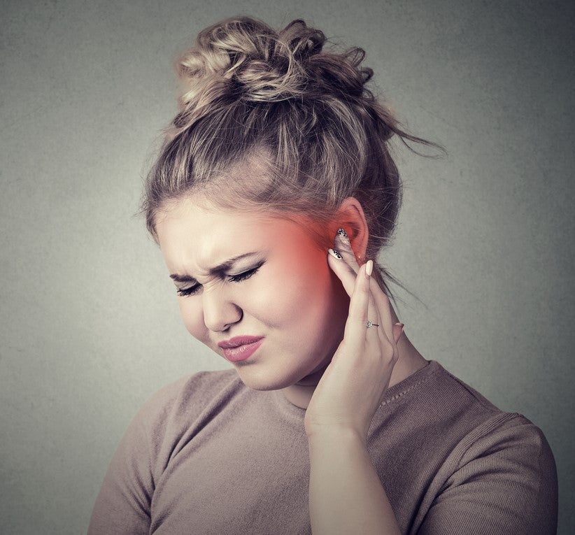 Woman with red painful ear